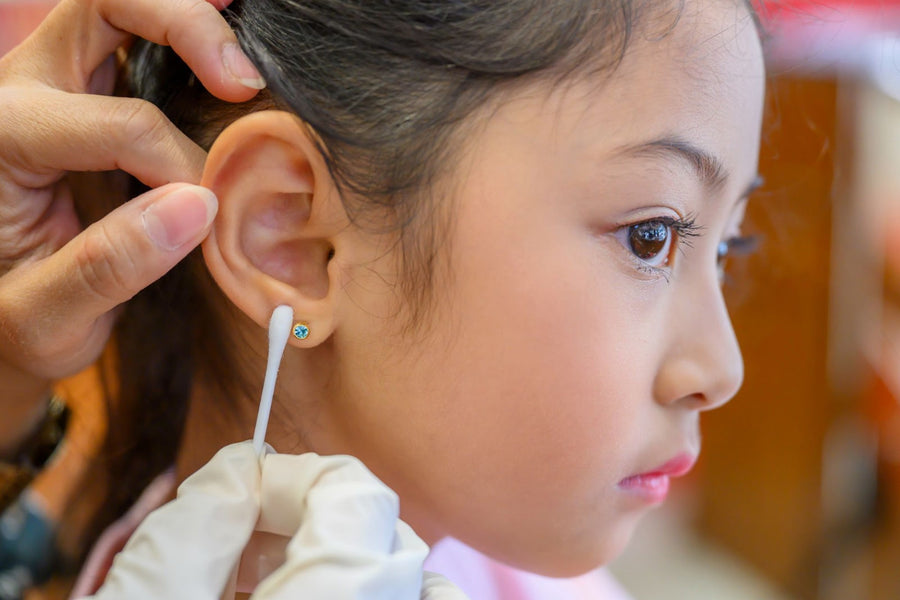little girl with her ear pierced