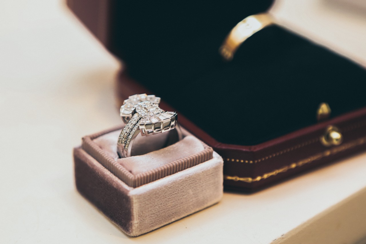 a platinum engagement ring in a gray jewelry box