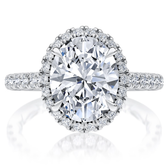 A white gold oval-cut diamond halo engagement ring