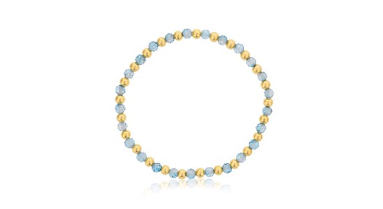 a beaded bracelet featuring gold beads and blue topaz beads