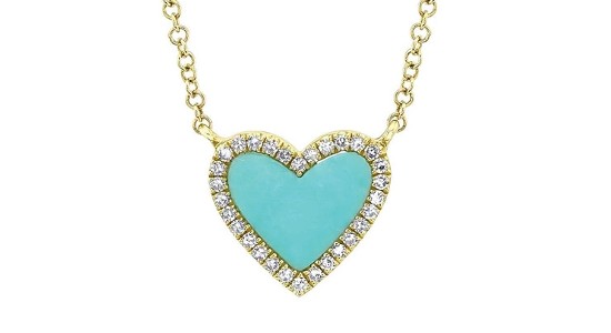 a yellow gold necklace featuring a turquoise heart-shaped pendant with diamond accents