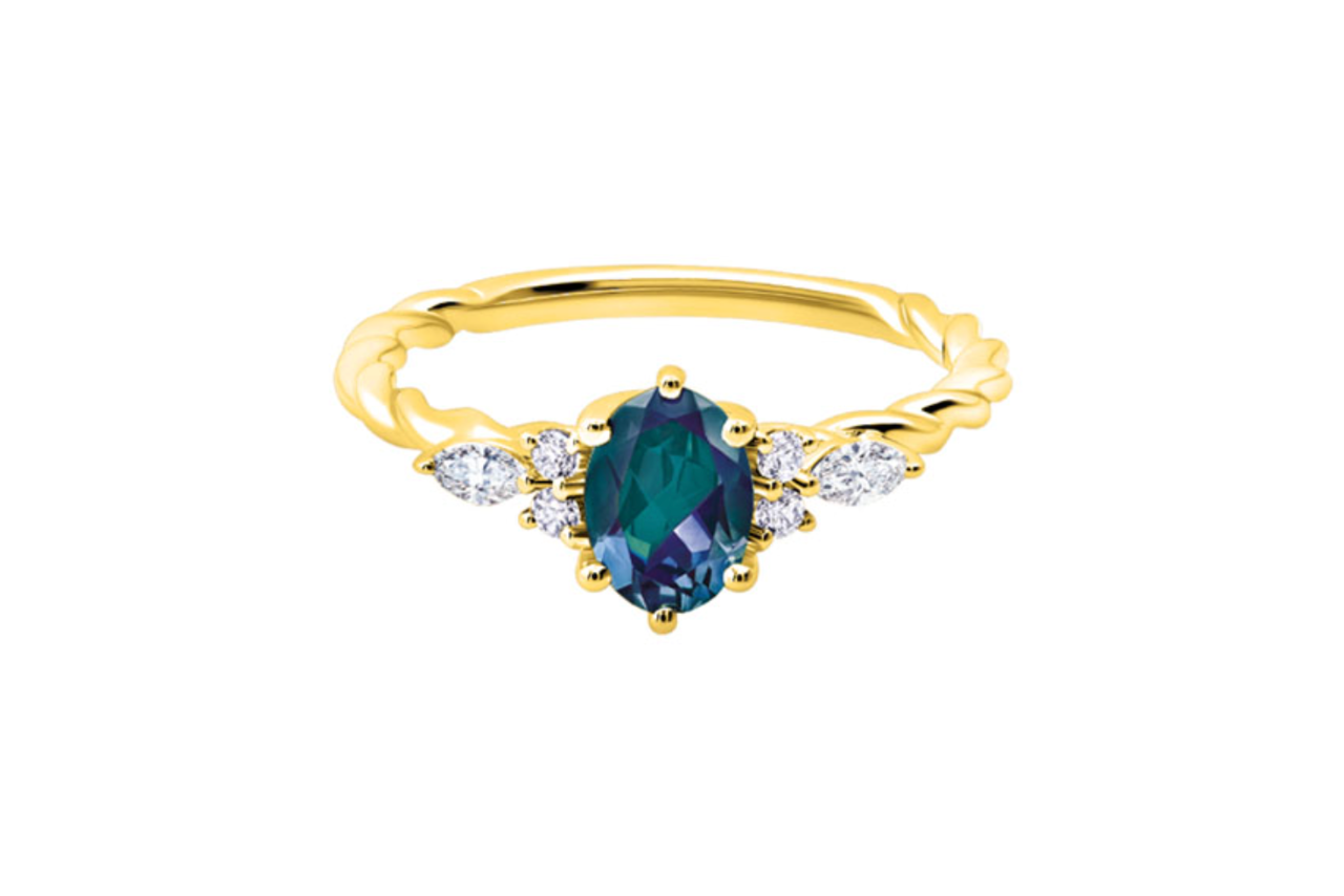 A yellow gold ring with an alexandrite center stone and a diamond twisted shank.
