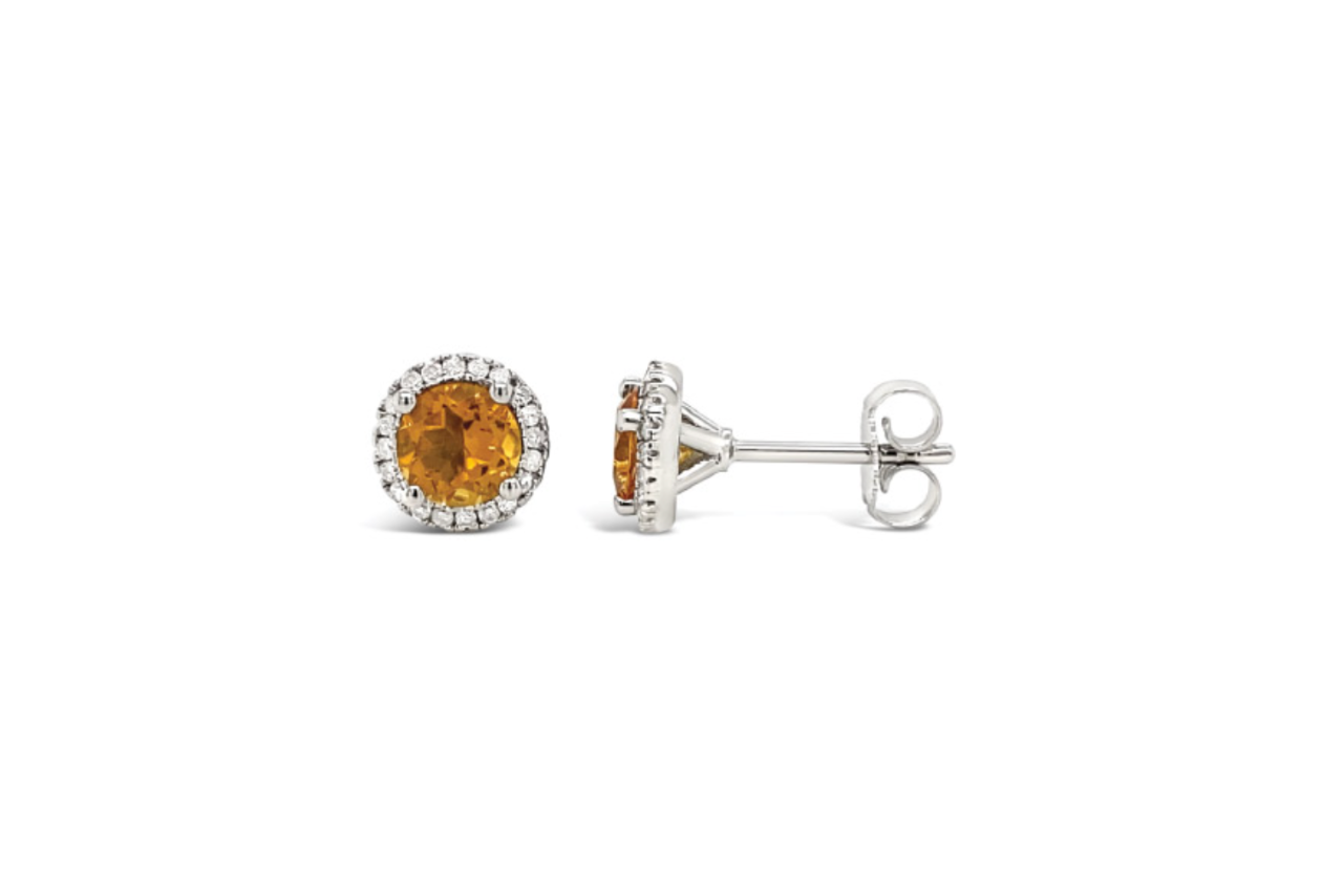 A pair of sterling silver diamond and citrine stud earrings.