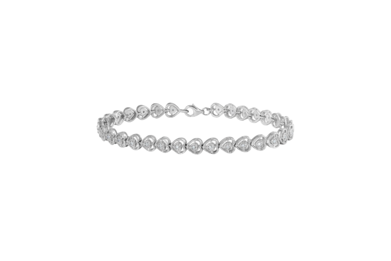 A sterling silver diamond bracelet, the diamonds shaped into hearts around the band.
