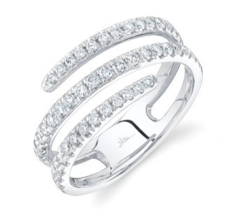 a wrap-around fashion ring with diamonds and crafted with 14k white gold.