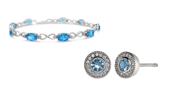 a blue topaz bracelet featuring infinity symbol motifs and a pair of blue topaz stud earrings