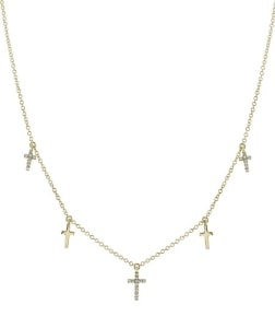 A yellow gold cross station necklace from Shy Creation.