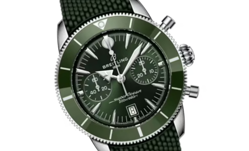 A close-up of a Breitling Superocean watch with a green dial and mesh strap, available at Albert&rsquo;s Diamond Jewelers.