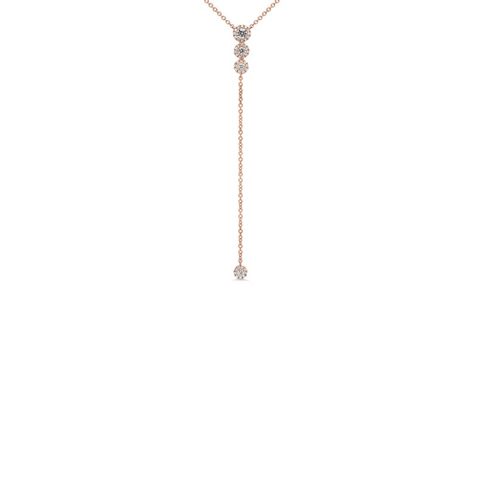 A rose gold diamond lariat necklace.