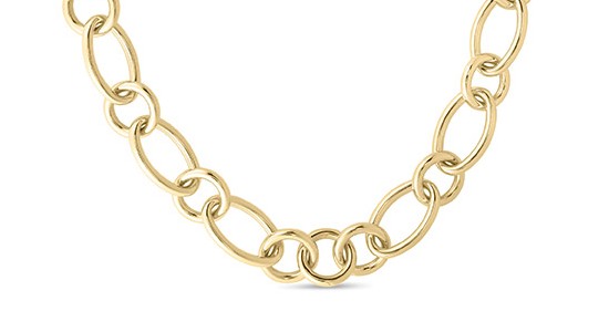 a yellow gold chain necklace featuring a chunky figaro link style.