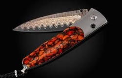The Gentac ‘Red Sails' features a light and resilient frame in aerospace grade titanium, inlaid with apple coral. The blade is 'Copper Wave' damascus with a core of VG5 steel; the one-hand button lock