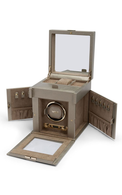 A beige jewelry storage with watch winder and mirror.