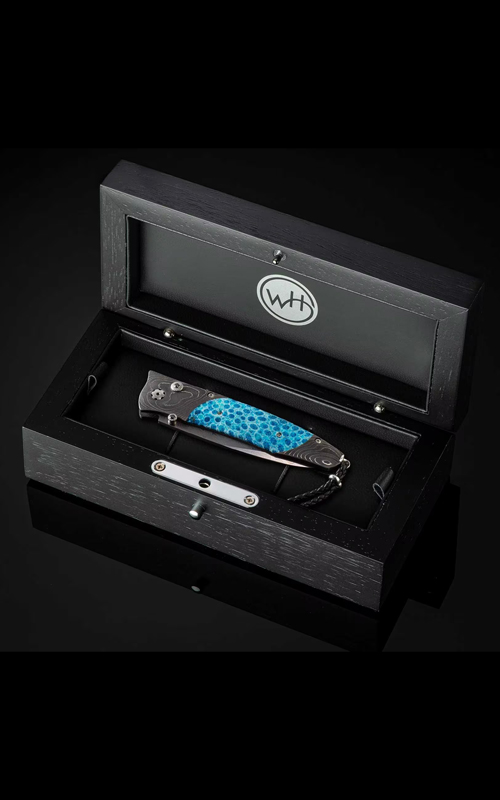 A knife in the wooden black box.