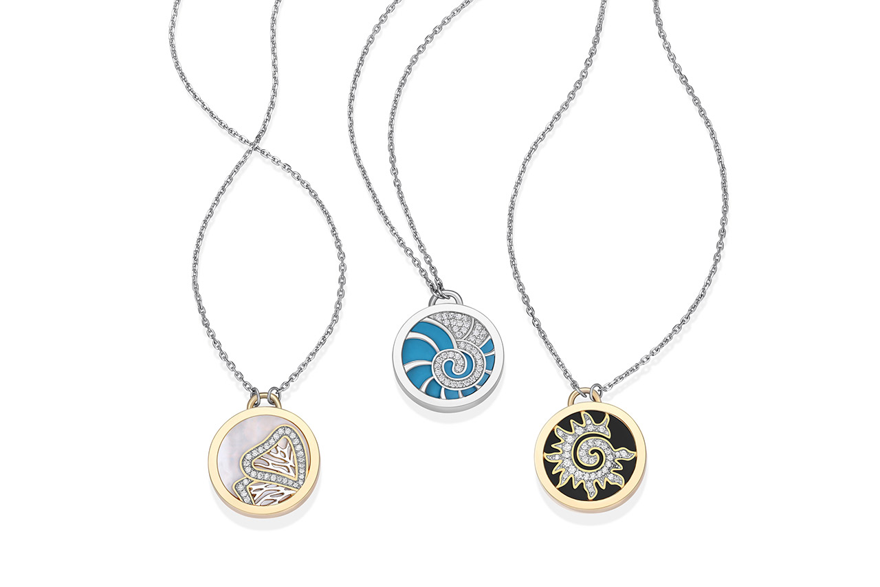 Three ELLE pendant necklaces with round pendants and colorful accents